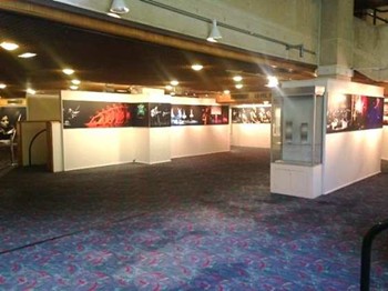 Level 2 foyer display area showing photographs of other shows and concerts